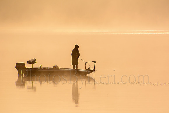 Fisherman In The Fog